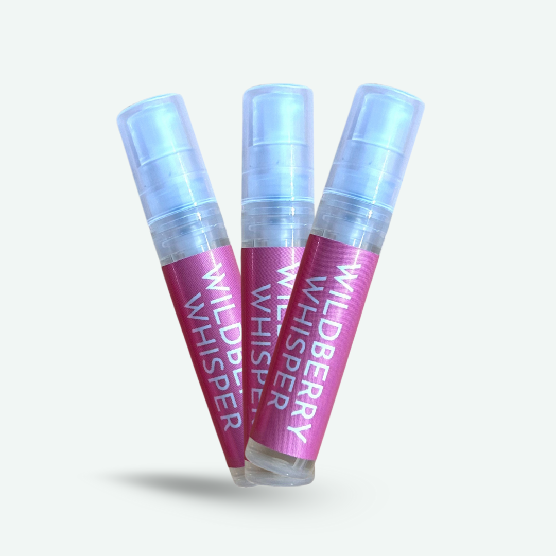 Three POPPIE Wildberry Whisper mini perfume spray bottles, available as part of the Mini Mystery Perfume offer.